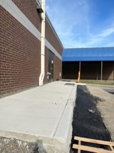 Poured new concrete sidewalk and curb at Area 2 maintenance entrance at Gowanda Elementary the week of August 29-September 2, 2022.