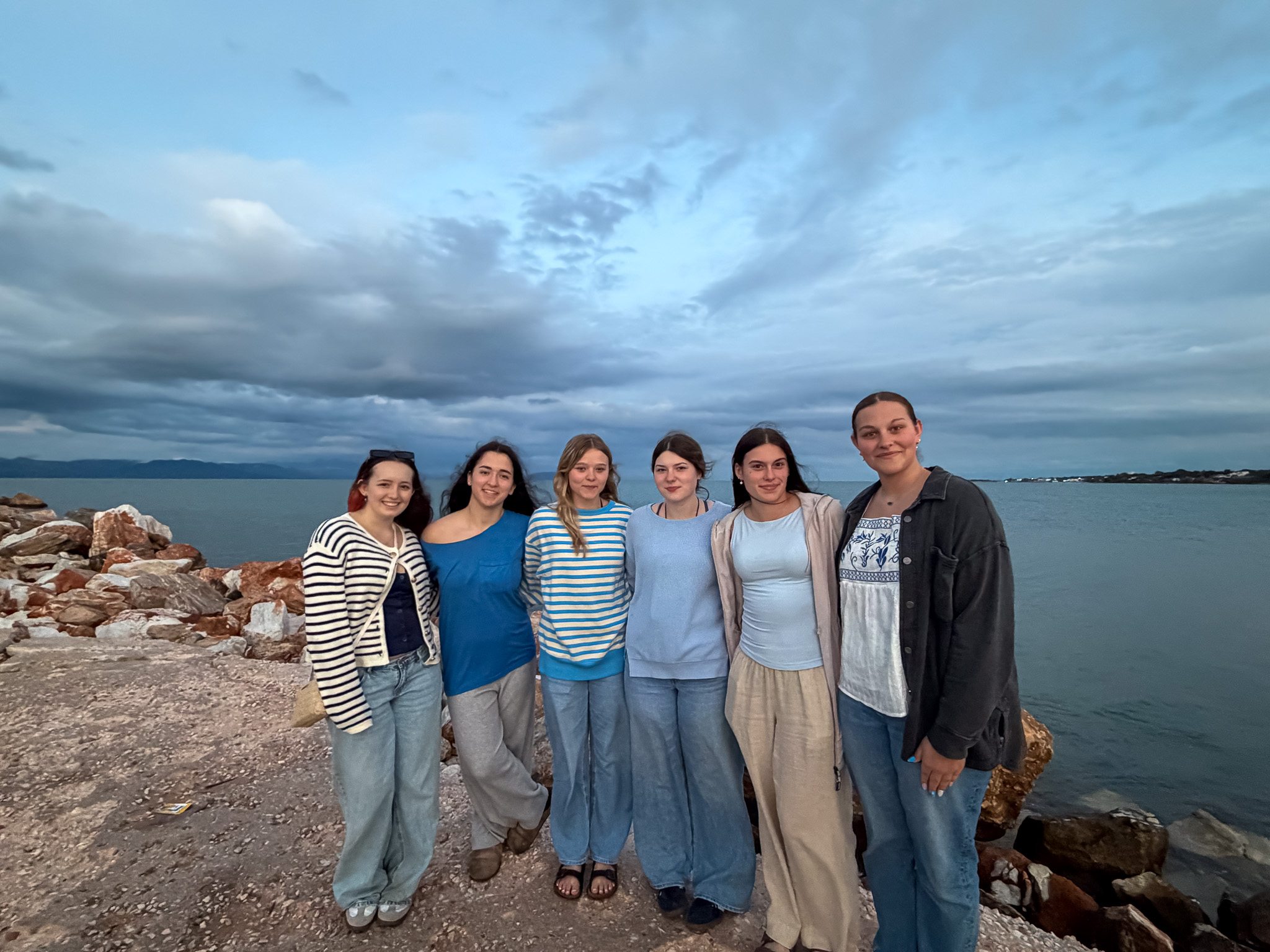 Students gathered overlooking the city of Athens.