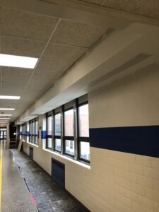 Tape, coat & sand soffit corridor C-106 ready for paint during winter break Dec. 23-30, 2021.