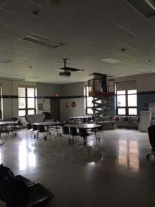 nstalled light fixtures in the middle school cafeteria during winter break Dec. 23-30, 2021.