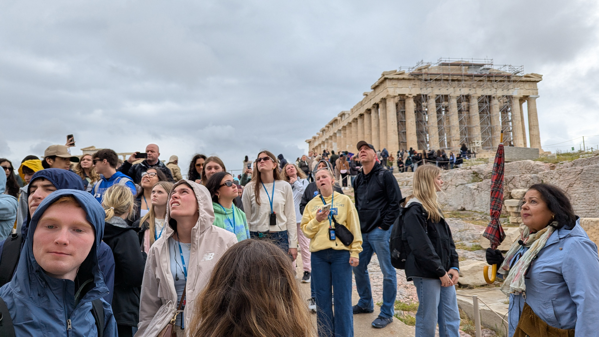 Students gathering at the base of the Parthenon.