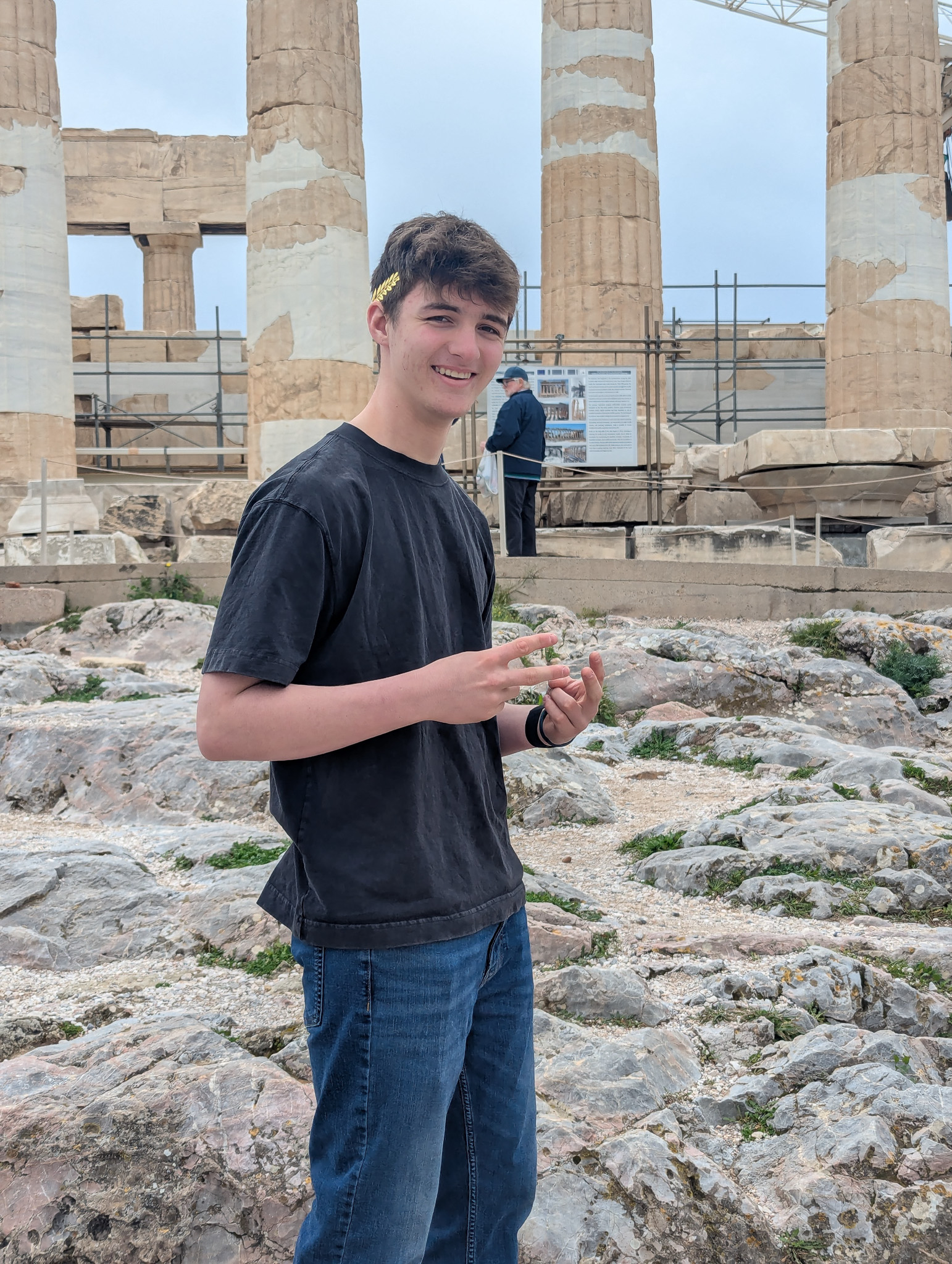 Wining team smiling with their crowns on the Acropolis.