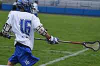 photo of Boys Lacrosse player throwing a lacrosse ball