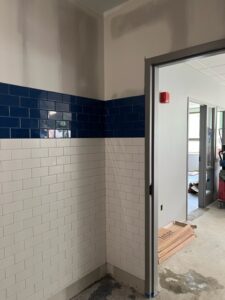Installed wall tile at Art Suite door entrance the week of May 9-13, 2022.