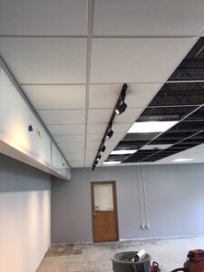 Installed ceiling tile and track lighting in the art room the week of May 2-6, 2-2022.