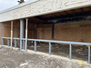 Installed two columns for the canopy entrance and tied in to the existing beam. Also installed knee-wall for the storefront and started partial framing at GES the week of January 9-13, 2023