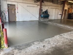 Pouring concrete slabs in bus garage